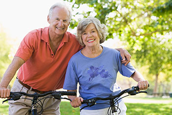 Photo of a man and woman on bicycles. Link to Life Stage Gift Planner Ages 60-70 Situations. Photo of a man and woman on bicycles. Link to Life Stage Gift Planner Ages 60-70 Situations.